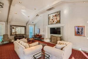a living room with couches and a flat screen tv at 2bd/1ba North Scottsdale Condo in Scottsdale
