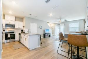 an open kitchen and dining room with a table and chairs at Brand New Luxury -King Bed- 15 min to attractions in Saint Augustine