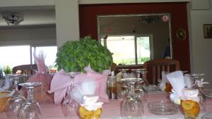 a table with a green plant in a vase on it at Kalloni Royal Resort in Kalloni +68 photos