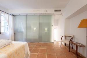 Postel nebo postele na pokoji v ubytování Hotel Can Verdera