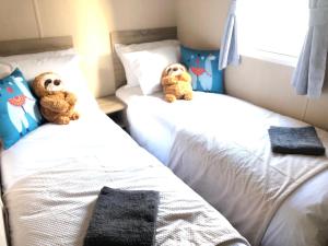 Ένα ή περισσότερα κρεβάτια σε δωμάτιο στο Angella's Caravan - Morecambe +3 φωτογραφίες
