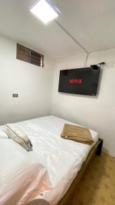 REST APARTMENT IN THE POBLADO客房内的一张或多张床位