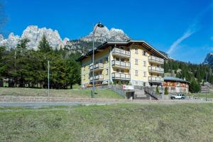 a large building in front of a mountain at Casa dei Caprioli in Pera