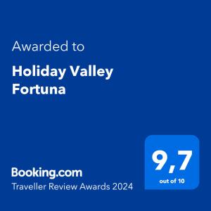 een blauw scherm met de tekst wilde vakantie vallei toronto bij Holiday Valley Fortuna in Adeje