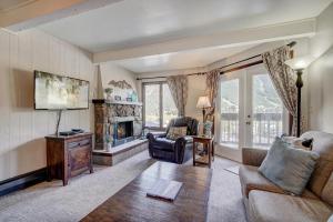 a living room with a couch and a fireplace at MTN View - Close to Lifts - Heated Pool - Copper in Wheeler Junction