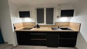 Kuchyň nebo kuchyňský kout v ubytování Suite L'échappée Belle + 7 fotografií