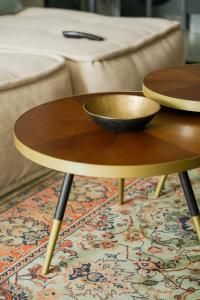 a wooden coffee table with a bowl on top of it at So7 Gauthier furnished flat in Casablanca