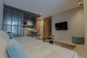 A television and/or entertainment centre at So7 Gauthier furnished flat