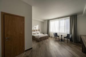 Letto o letti in una camera di Eclipse Winery Boutique Hotel