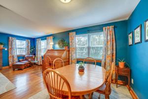 a dining room with a wooden table and chairs at Morgantown Home Less Than 1 Mi to West Virginia University in Morgantown