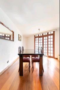a dining room with a table and chairs at Casa na Granja Viana - Cotia in Cotia