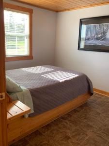 Postel nebo postele na pokoji v ubytování Net Loft Cottage