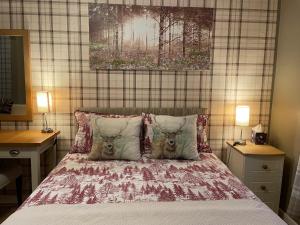 a bedroom with a bed with two heads on it at Little Connaught House in Portsmouth