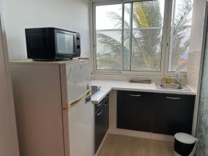 Kuchyň nebo kuchyňský kout v ubytování GITE PEI LA VANILLE Duplex Bord de Nature