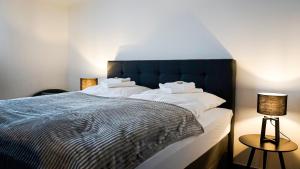 a bedroom with a large bed with white pillows at Si-View Doppelzimmer Zimmer 10 in Siegen