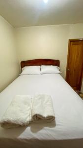 Un pat sau paturi într-o cameră la Suite de Asdruval