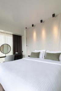 Vuode tai vuoteita majoituspaikassa Brasil Suites Boutique Hotel