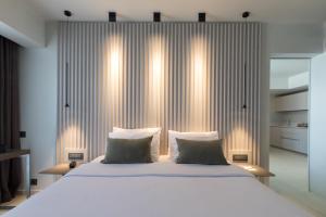 Vuode tai vuoteita majoituspaikassa Brasil Suites Boutique Hotel