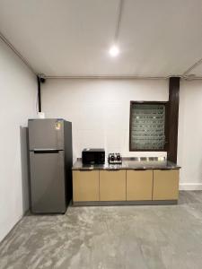 a kitchen with a refrigerator in a room at House Ju in Bangkok +36 photos