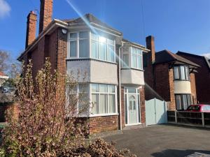 a large brick house with white doors and windows at University View-Off-Street Parking-Sleeps 8-Fast WiFi in Nottingham