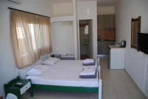 Postel nebo postele na pokoji v ubytování Soula appartments