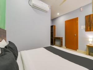 Krevet ili kreveti u jedinici u okviru objekta OYO Hotel Ragas