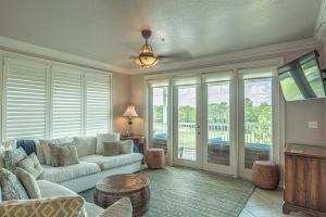 a living room with a couch and a table at Caddyshack Condo in Big Blackjack Landing