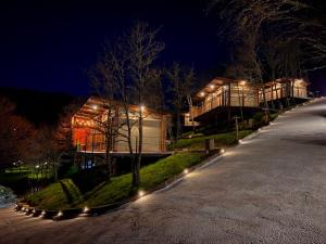 a building with lights in front of it at night at Casal Oseira in Ourense