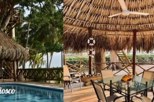 un complexe avec une table et une piscine dans l'établissement Cabaña en Playa del Francés, à El Puertón