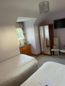 Ліжко або ліжка в номері Padua Guest Accommodation Rosslare