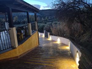 a pathway with lights on the side of a building at Paraje fuente del pintor in Iznalloz