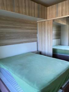 Krevet ili kreveti u jedinici u okviru objekta Apartamento cobertura 2 quartos, 2 banheiros.