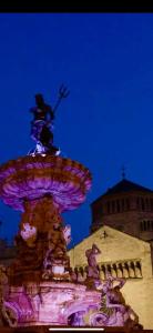 a water fountain in front of a building at Appartamenti ClesioResidenceBuonconsiglio in Trento