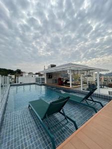 a swimming pool on the roof of a building at Arosa Rio Hotel in Rio de Janeiro