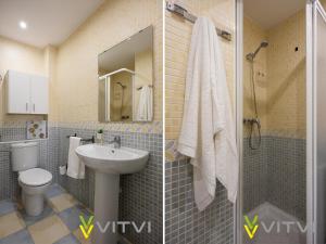 La salle de bains est pourvue d'un lavabo, de toilettes et d'une douche. dans l'établissement Vitvi Fuengirola - Chinorros Centro, à Fuengirola