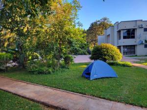a blue tent on the grass in a yard at Sable Suites B1, 1 Bed Apartments in Kabulonga in Lusaka