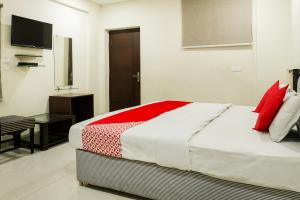 Krevet ili kreveti u jedinici u okviru objekta OYO Karthikeya Pride