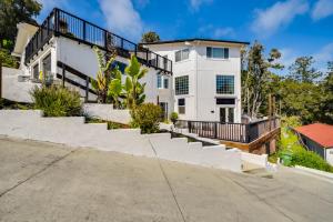 a large white house with stairs in front of it at Comfy Aptos Apartment Near Beaches and Santa Cruz! in Aptos