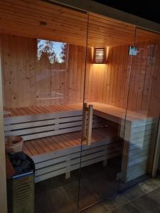 an empty sauna with a light on top of it at Chiplakova cottage by MRS in Berovo