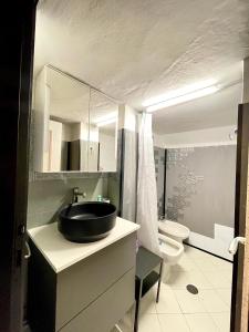 a bathroom with a sink and a toilet at bilocale 40 mt dal mare 2 piani in Rimini
