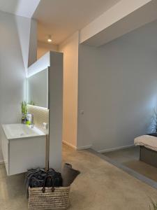 a bathroom with a sink and a mirror at Sievershof Heidestrand in Wietzendorf +28 photos
