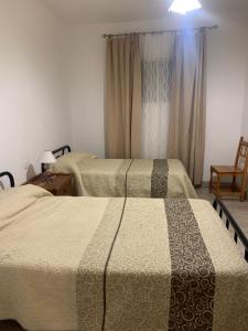 Postel nebo postele na pokoji v ubytování Casa Cuesta de Triana