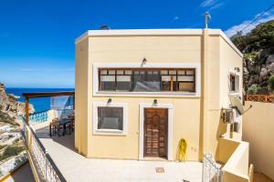 a house with a view of the ocean at Melina Kyra Panagia in Kyra Panagia