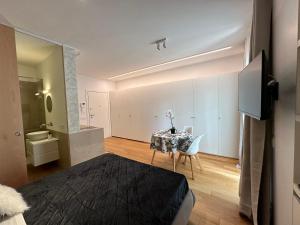 Postel nebo postele na pokoji v ubytování Palazzo Metropolis
