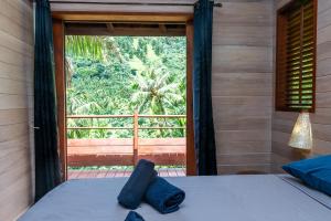 En eller flere senge i et værelse på Villa Terai 2BR Legends Moorea wPool