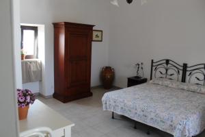 Postel nebo postele na pokoji v ubytování Trulli Nonna Grazia -miramonti