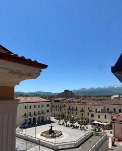 a view of a city with buildings and a fountain at Plebiscito Old Fashion in Castel di Sangro