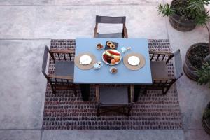 an overhead view of a blue table with food on it at The Red Winehouse in Foinikiá
