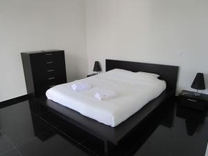 Ένα ή περισσότερα κρεβάτια σε δωμάτιο στο Casa numa zona tranquila +13 φωτογραφίες
