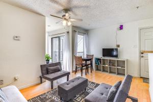 a living room with a couch and a chair at Cozy Fort Worth Condo Close to Downtown! in Fort Worth